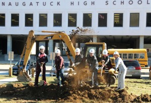 Naugatuck High School Principal Janice Saam, right, with five of her students throw shovels of dirt during a groundbreaking ceremony April 2 at the school to mark the start of the $81 million renovation project. –FILE PHOTO 