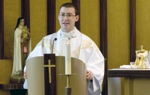 Rev. Michael Casey of Prospect gives a mass at St. Mary´s Hospital in Waterbury Monday. The Archdiocese ordained seven new priests recently including Rev. Casey and Rev. John Mariano of Naugatuck. –RA ARCHIVE 