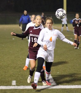 Naugatuck’s Kyla Magalhaes (19) and Watertown’s Erin Montambault (4) battle for position Wednesday night during the NVL soccer final game at Municipal Stadium in Waterbury. –ELIO GUGLIOTTI