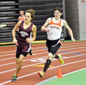 Naugatuck's Mark Zamani and Watertown's Seamus Rafferty battle during their leg of the 4-by-800-meter relay at the NVL indoor boys and girls track championships Jan. 28 at the Floyd Little Athletic Center at Hillhouse High School in New Haven. The Naugatuck boys came in sixth at the meet. –LUKE MARSHALL 