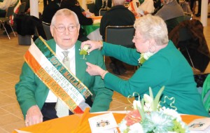 Barbara Mallane pins a corsage on her husband Roy Mallane Monday in the church hall of St. Francis Church in Naugatuck. Roy Mallane was honored as Naugatuck’s Irish Mayor for the Day. –LUKE MARSHALL 