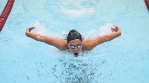 Naugatuck’s Cara Rotatori swims the butterfly stroke in the 200 individual medley Sept. 19 versus Watertown in Naugatuck. The Greyhounds had 60 best times during the meet. –LUKE MARSHALL 