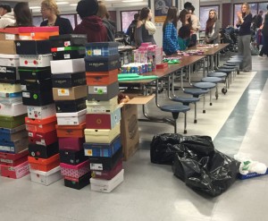 Shoeboxes are piled up at Naugatuck High School during ‘A Shoebox Christmas’ in December. The event provided decorated shoeboxes full of gifts for the students in the Naugatuck Head Start and School Readiness program. –CONTRIBUTED 