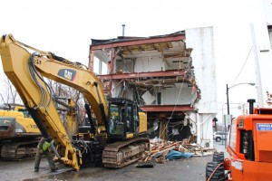 An excavator is used during demolition of the vacant building at 1 South Main St. in Naugatuck March 27. The demolition was completed over the weekend. –LUKE MARSHALL 