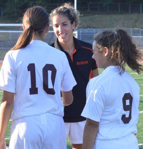 Watertown head coach Christina Nunes, a former assistant coach at Naugatuck, talks with Naugatuck players Sept. 16 when the Greyhounds faced Watertown in Naugatuck. The Greyhounds won the game, 3-1. –KEN MORSE 
