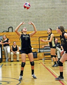 Woodland’s Maddie Hupprich (6) sets the ball Sept. 24 versus Watertown in Beacon Falls. Woodland won the game, 3-0. -ELIO GUGLIOTTI 