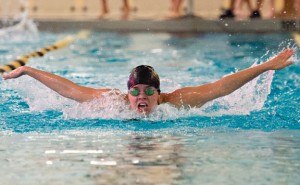 Woodland's Kyla Drewry swims the 100 butterfly Tuesday versus Oxford in Beacon Falls. Drewry won the event and the Hawks won the meet, 101-85. –REPUBLICAN-AMERICAN 