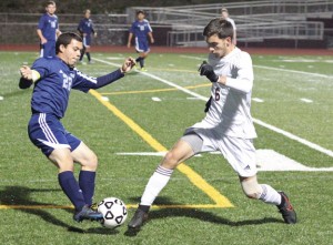Naugatuck’s Candido Carrelo (6) duels with Ansonia’s Dave Perez (22) for possession of the ball Monday in Naugatuck. The Greyhounds won, 1-0, and head into the NVL tournament seeking their third straight title. –ELIO GUGLIOTTI 