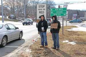 Prospect Congregational Church Youth Group members Collin Lacovelli, left, and Nicholas Hudson collect money to help the homeless at the intersection of Route 68 and Route 69 in Prospect Jan. 30 during the group’s 14th annual Homeless Awareness Sleepout. –LUKE MARSHALL
