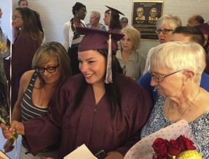 Bailey Messenger, center, celebrates with family members following her graduation from Naugatuck Adult Education Thursday night. With her are her mother, Courtney Messenger, left, and her great grandmother, Hellen Rotunda. -REPUBLICAN-AMERICAN