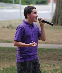 Vinny Longo, 12, of Naugatuck, sings ‘Bring me to life’ by Evanescence July 28 during Titanium Day on the Naugatuck Green. The event was held to raise awareness of domestic abuse and the services offered to victims by Safe Haven of Greater Waterbury. –ELIO GUGLIOTTI